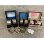 A collection of Sterling silver napkin rings to include 3 boxed pairs and 3 single examples, various