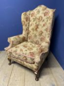 Large gentleman's wing back fireside chair, upholstered in beige and red floral fabric, as found etc
