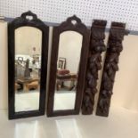 Pair of small narrow wooden framed mirrors, and a pair of carved decorative wall sconces