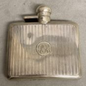 A Sterling silver hip flask with engine turned decoration by Sampson Morden & Co London 1919, 120g