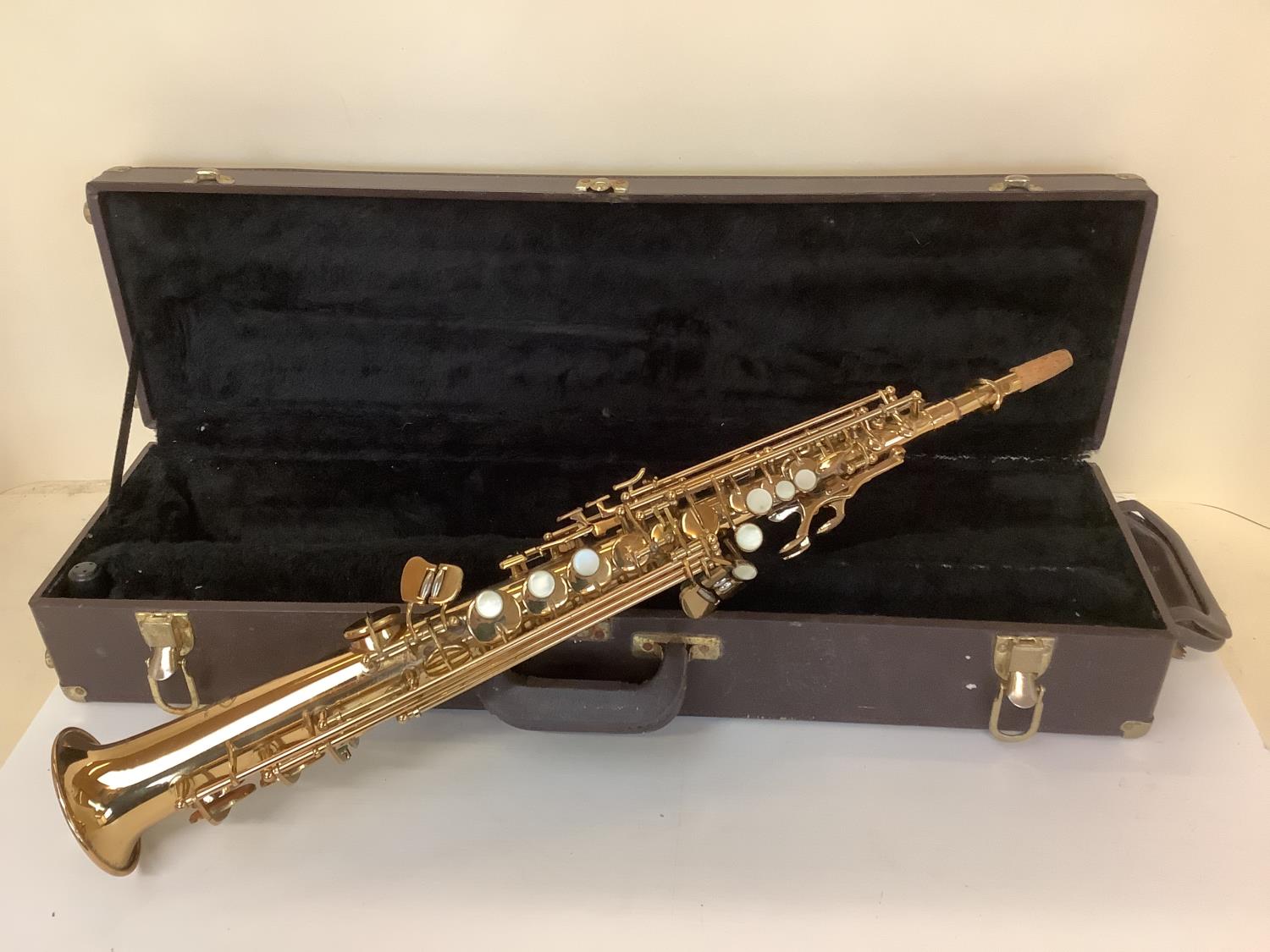 A cased soprano saxophone, stamped Eckharl, Distributed by Vincent Bach International, Ltd, see i