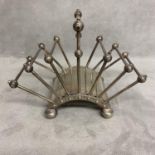 A Hukin and Heath electroplated folded toast rack, designed by Dr Christopher Dresser Model number