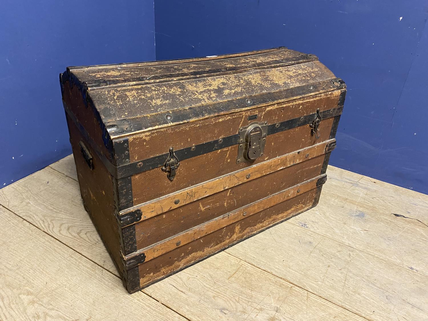 Domed top storage trunk with wooden slats and handles