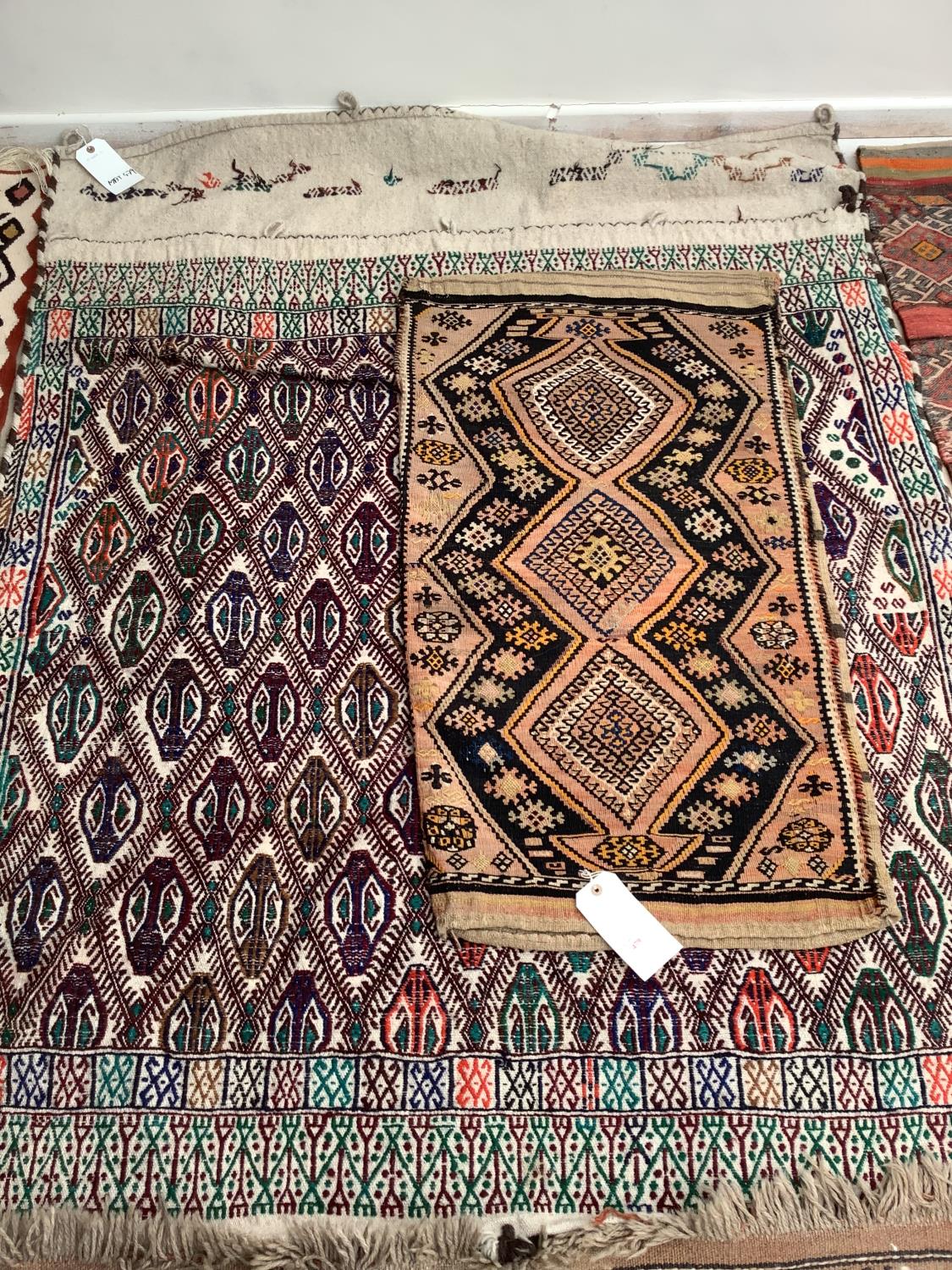 2 rug bags; 133 x 174cm; 59 x 104cm; All being sold on behalf of Charity; see images for details