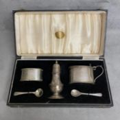 A sterling silver condiment set in velvet lined box by S Blackensee and Son Birmingham 1909 (