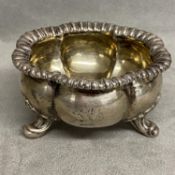 A sterling silver salt with gilt interior, raised on 3 scrolling feet, Paul Storr, London 1786, 134g