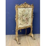 A gilt framed deocrated fire screen, inset glazed fine needlework floral panel, as found - much wear