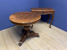 Small circular table with pedestal base and lion paw feet, and a fold over tea table with cabriole