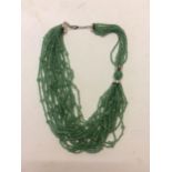 Jade necklace, C20th, 3 strands of Jade (type 3) beaded multistrand necklace, in a Shanghai Tang