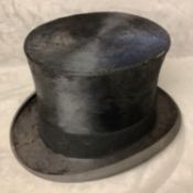 A Gentlemans silk top hat, by Lock & Co, condition used and wear to underside of rim, with strap