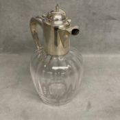 A sterling silver topped claret jug of bulbous reeded design and star base, by Alexander Clark &