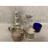 A collection of Sterling siler items to include 2 mustards, a toddy decanter sugar shaker various