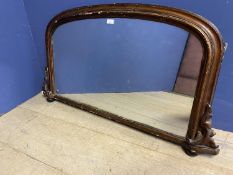 Arched shaped over mantle mirror, much wear to gilding, 101cm wide approx