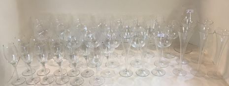 A quantity of modern glassware to include large red wine goblets, champagne flutes etc