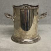 A Sterling silver wine sleeve with applied loop handles and cast rim by Atkin brothers Sheffield,