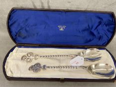 Set of boxed Victorian sterling silver salad servers, with twist and pierced trefoil finials, by