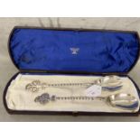 Set of boxed Victorian sterling silver salad servers, with twist and pierced trefoil finials, by