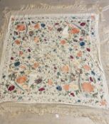 Silk shawl, gream ground, with needlpoint decoration of flowers and birds of prey, with a long