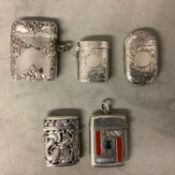 Four Sterling silver vesta cases and an oriental unmarked white metal vesta case, various dates