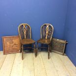 Two elm stick back chairs, an carved oak panel, engraved crest inscribed with "Unity & Loyalty", and