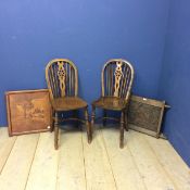 Two elm stick back chairs, an carved oak panel, engraved crest inscribed with "Unity & Loyalty", and