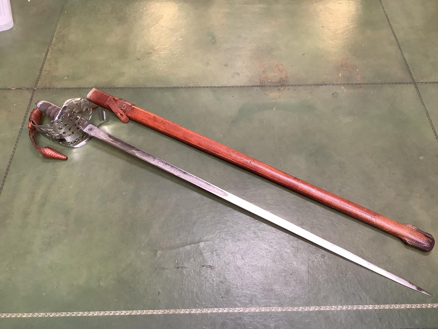 An early C20th officers dress sword of British Manufacture, Nickel plated pierced basket, with