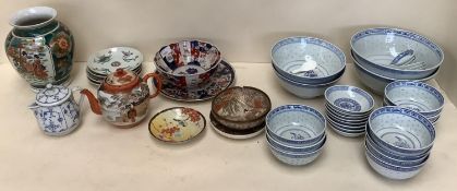 A quantity of modern blue and white oriental wares, an imari bowl, and other plates in the