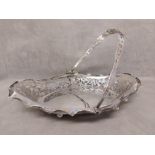 Sterling silver swing handled basket with pierced rim on four ball feet, Joseph Gloster Ltd