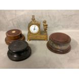 A French gilt metal mantle clock, and three turned wooden bases or socles
