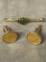 Pair of 1/10 Krugerand cufflinks in 9ct gold mounts, 13.5 grams, and a 9ct gold bar brooch, total