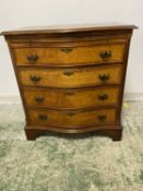 A modern, walnut veneered style, serpentine front chest of 4 drawers with brushing slide, some wear,