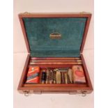 A wooden cased Parker & Hale gun cleaning kit, in used condition, and