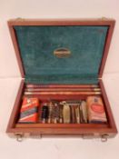 A wooden cased Parker & Hale gun cleaning kit, in used condition, and