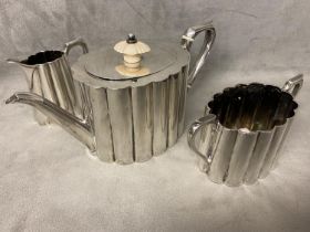 Sterling silver bachelors three piece tea set, reeded design with bone finial and separators, Thomas