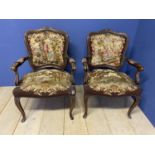 A pair of show framed and upholstered tapestry Victorian Fauteuils
