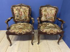 A pair of show framed and upholstered tapestry Victorian Fauteuils