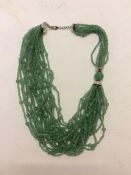 Jade necklace, C20th, 3 strands of Jade (type 3) beaded multistrand necklace, in a Shanghai Tang