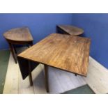 A D-end faded mahogany dining table, with a central drop leaf table as extra central leaves