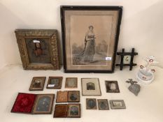 A quantity of iconic and religious artefacts, including a gilt framed painting and tin relief of