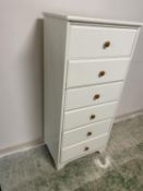 A modern tall narrow chest of 6 drawers, painted white with pine coloured knob handles, 58cm W x