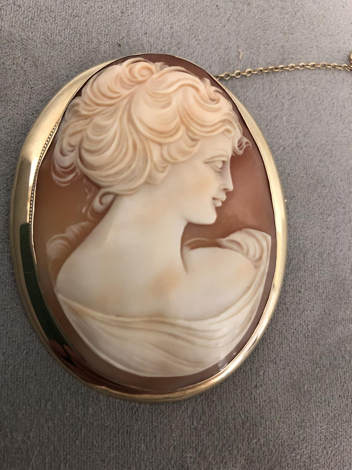 9ct gold mounted shell Cameo brooch, with oval image of a classical lady, 6cm x 7.5cm, 30grams gross