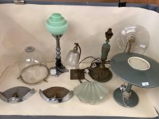 A quantity of lighting to include table lamps with green shades, clear bell shade, etc and a pair of