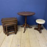 A circular pedestal table, and an oak nest of 3 tables, and a stool