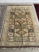 Rug in cream, brown, blue centre with cream borders, 140 x 212cm APPROX; with certificate: SINBAD