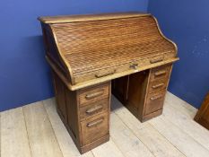 A good oak tambour front pedestal desk, with fitted interior