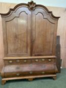 Very large French oak bombe commode style linen press/chest, with domed top and shell finial