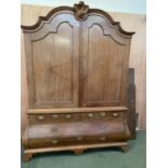 Very large French oak bombe commode style linen press/chest, with domed top and shell finial