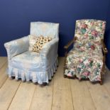 A duck egg blue loose covered bedroom chair, and another wooden framed chair with floral covers