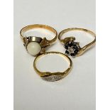 An C18ct gold and diamond three stone ring, a 18ct gold and pearl set ring, and a 9ct gold