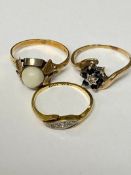 An C18ct gold and diamond three stone ring, a 18ct gold and pearl set ring, and a 9ct gold